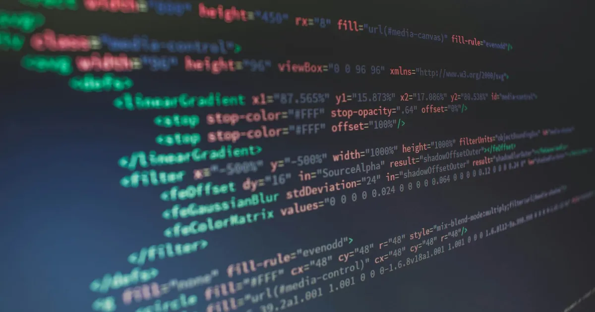 An abstract, closeup image of code in a code editor that is blurred